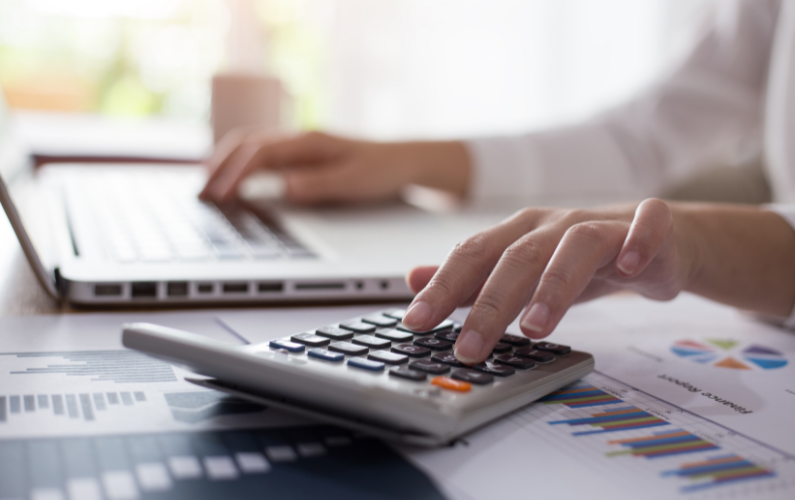 Woman using calculator